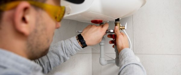 worker-repairing-water-heater-(2)